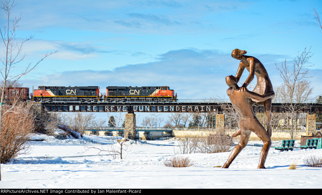 CN 2302 pulls 402 across the Rimouski river bridge